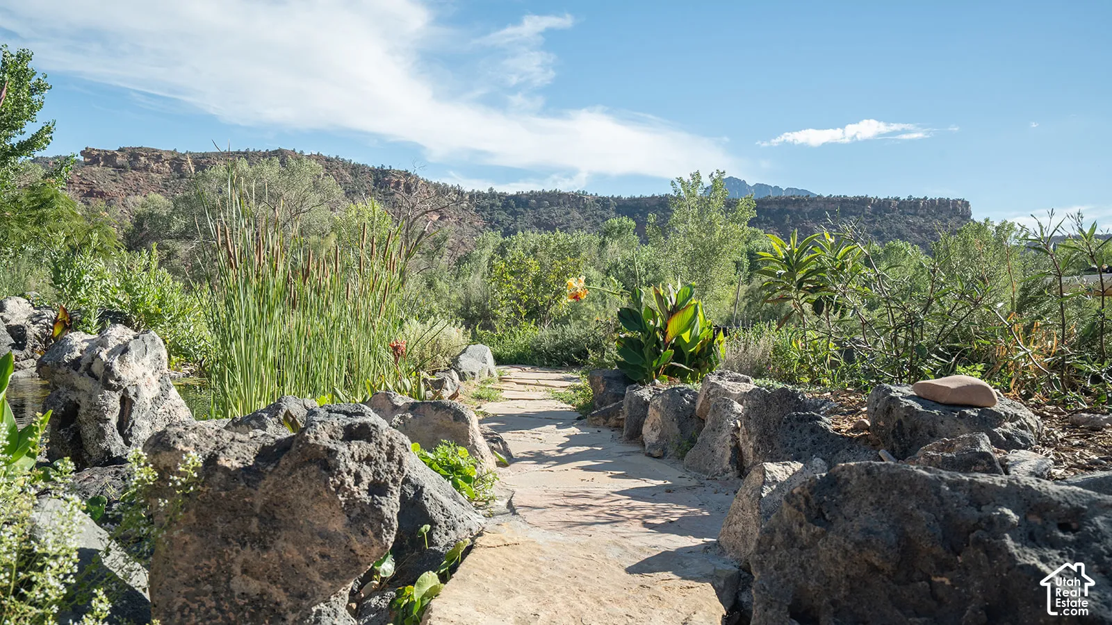 Stone pathway with natural rock borders and mature landscaping