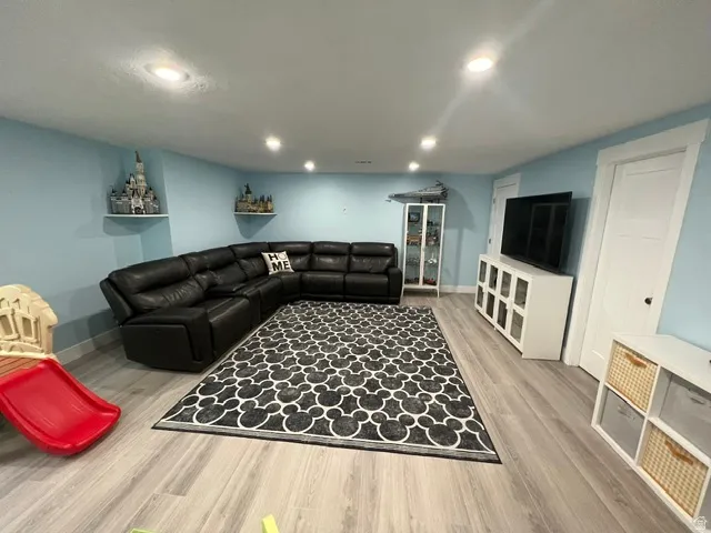 Recreational space featuring recessed lighting, light wood-finish flooring, and white trim