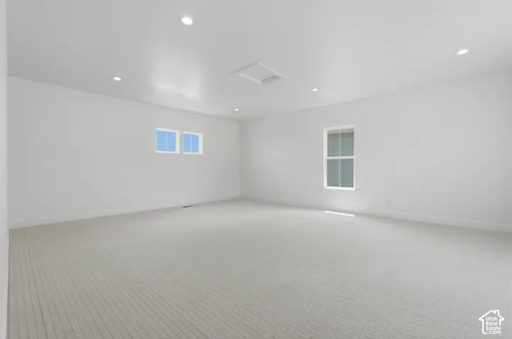 Yes there is a rec room on the first floor! Spacious room featuring neutral carpet, multiple recessed ceiling lights, and white walls
