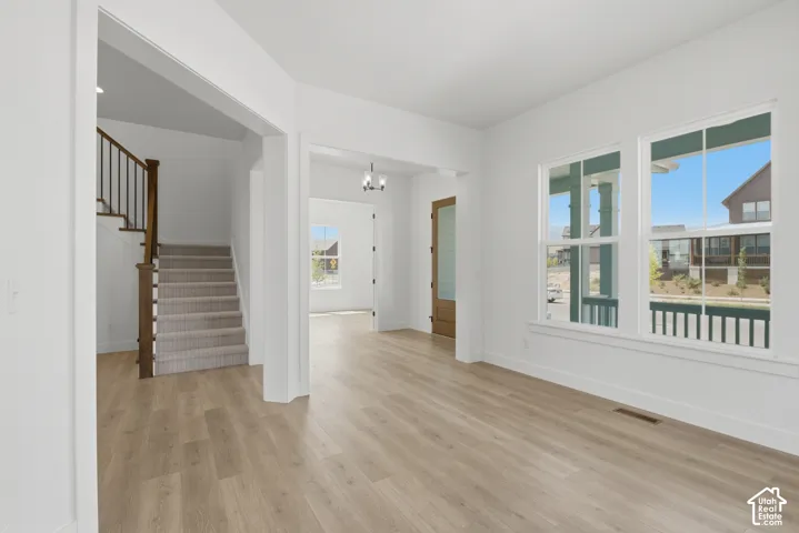 Light wood-finish flooring throughout the main level