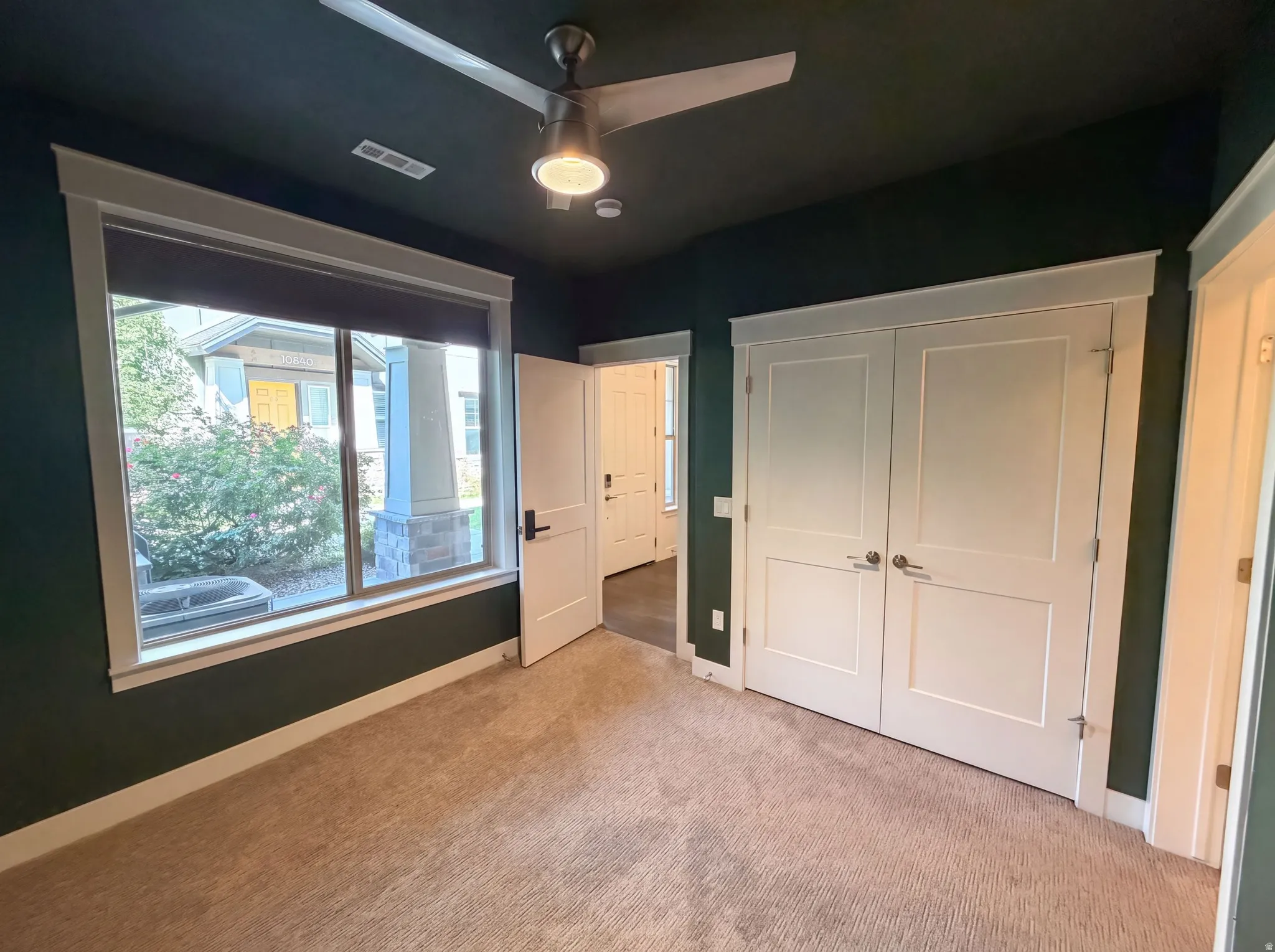 Wall-to-wall carpeting and neutral wall tones