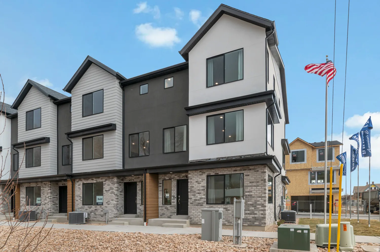 Multi-story townhome with a modern architectural style