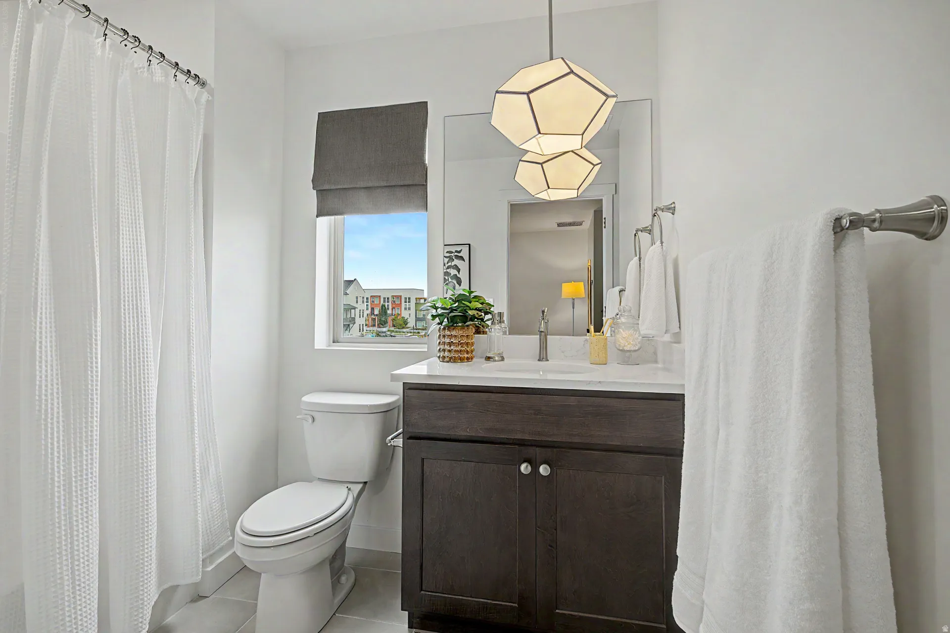 Dark wood-finish vanity with a white countertop and rectangular sink