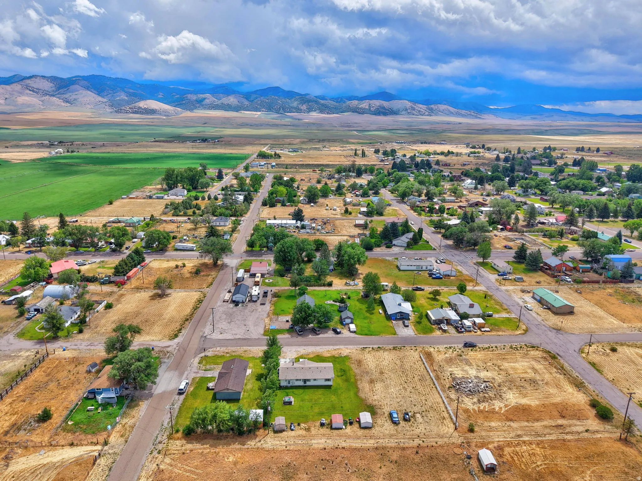 Expansive open terrain with scattered residential structures