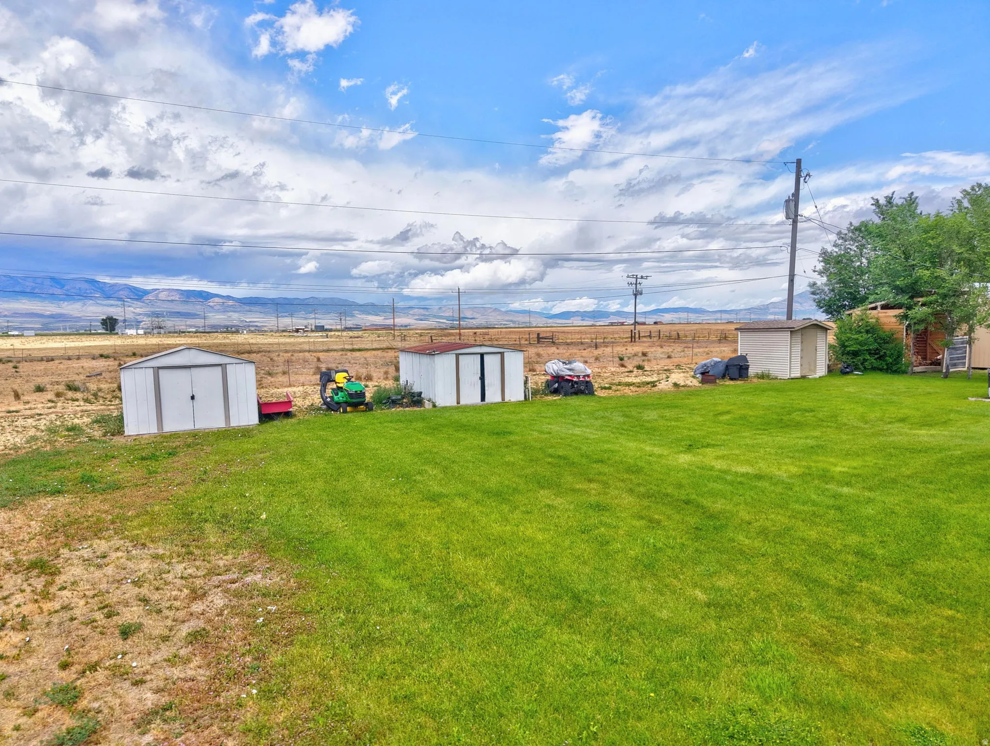Expansive green lawn with mountain backdrop