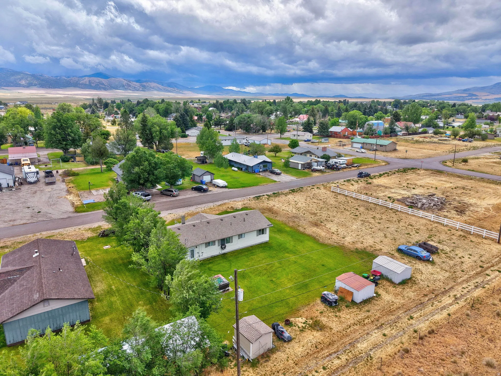 Expansive lot featuring a single-story residence and multiple outbuildings