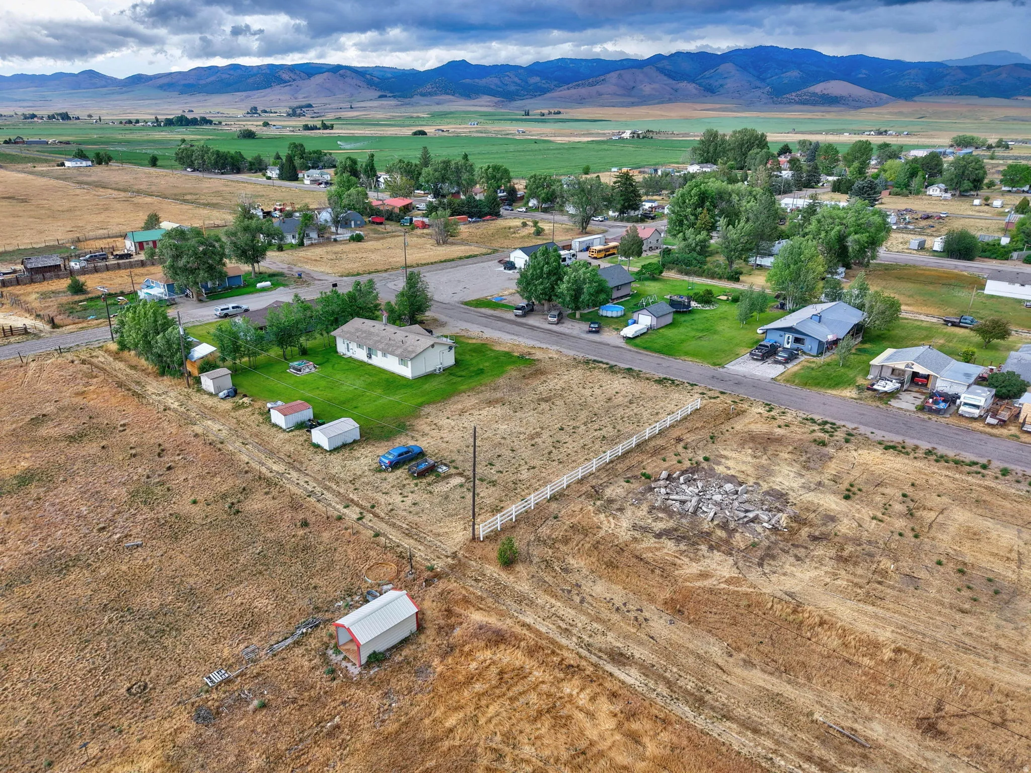 Expansive land parcel featuring open fields and distant mountains