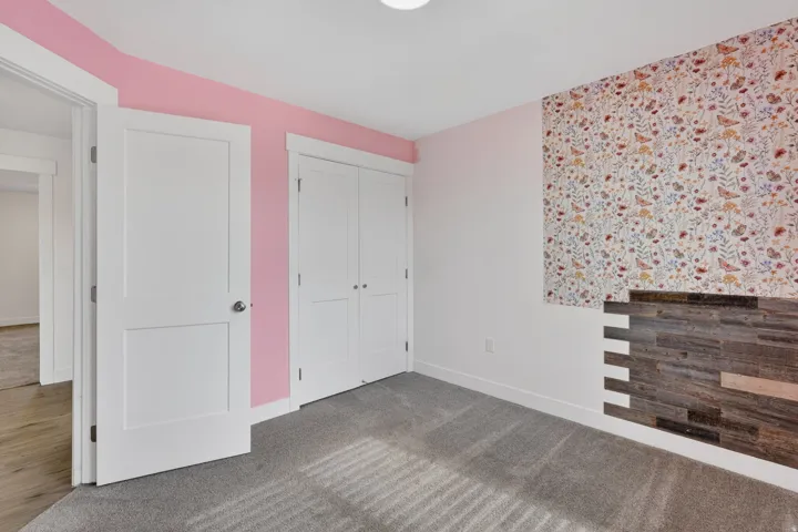 Carpeted flooring, white trim, recessed lighting, and white panel doors