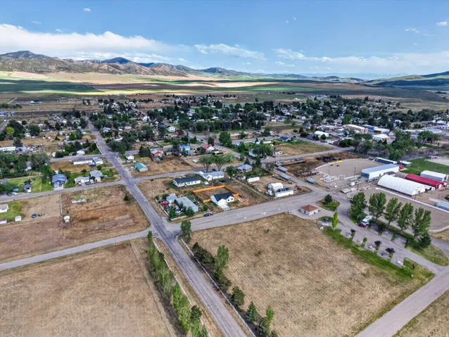 Aerial perspective showcasing a community setting with varied residential structures and commercial buildings