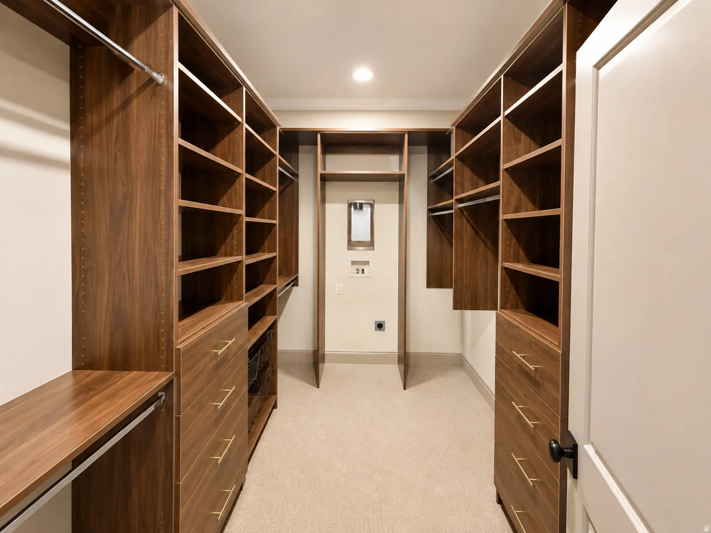 Primary custom closet 2 with built in stackable laundry hookups