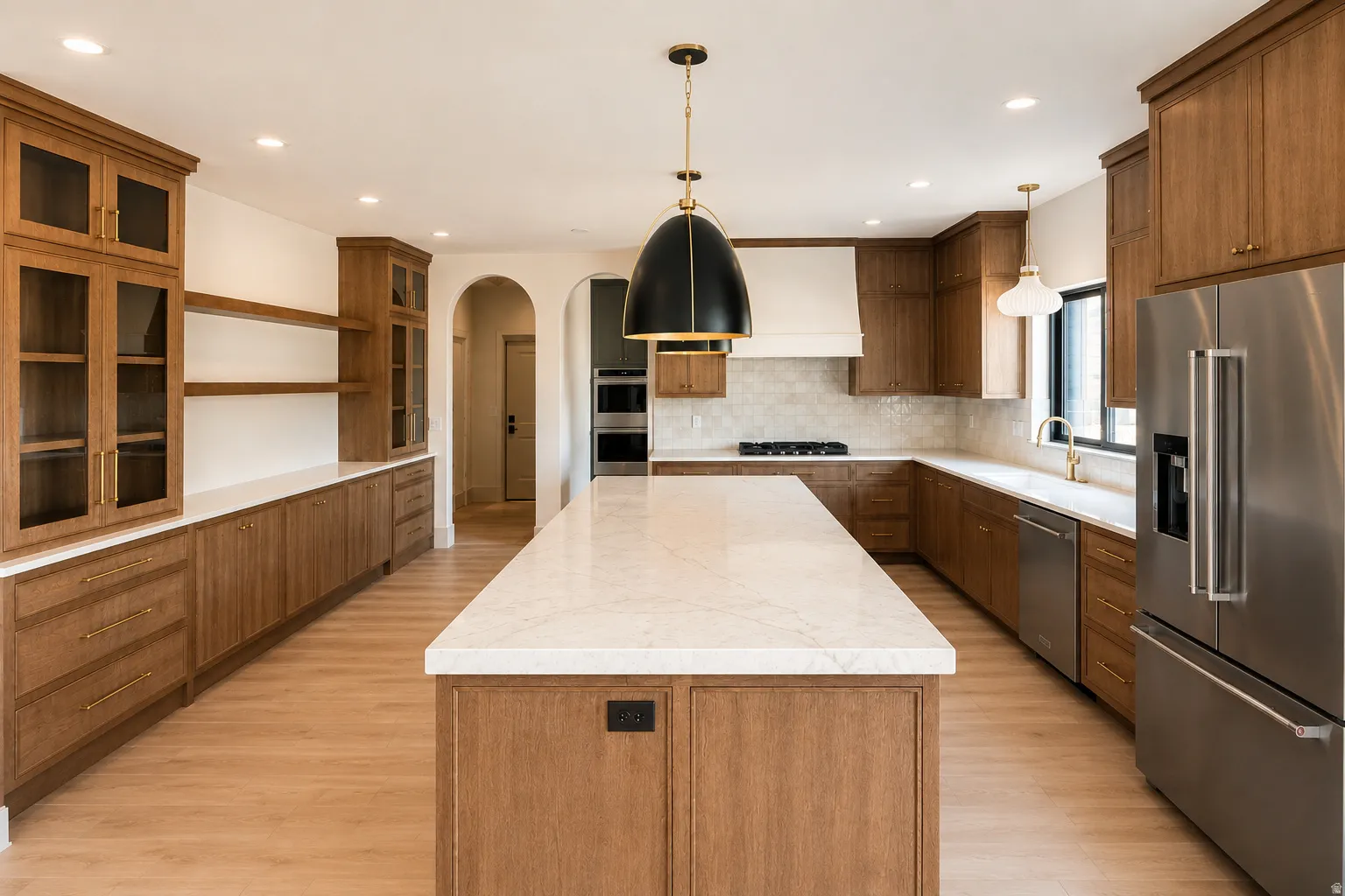 Expansive kitchen with plenty of storage, wood cabinetry and brand new appliances.