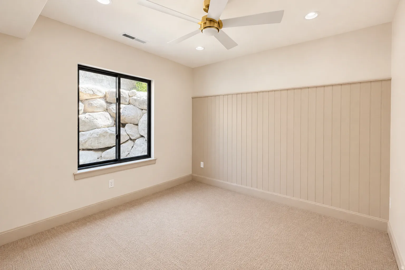 Bedroom 4 with lots of natural lighting, brand new carpet, windows, lighting, and accent wall.