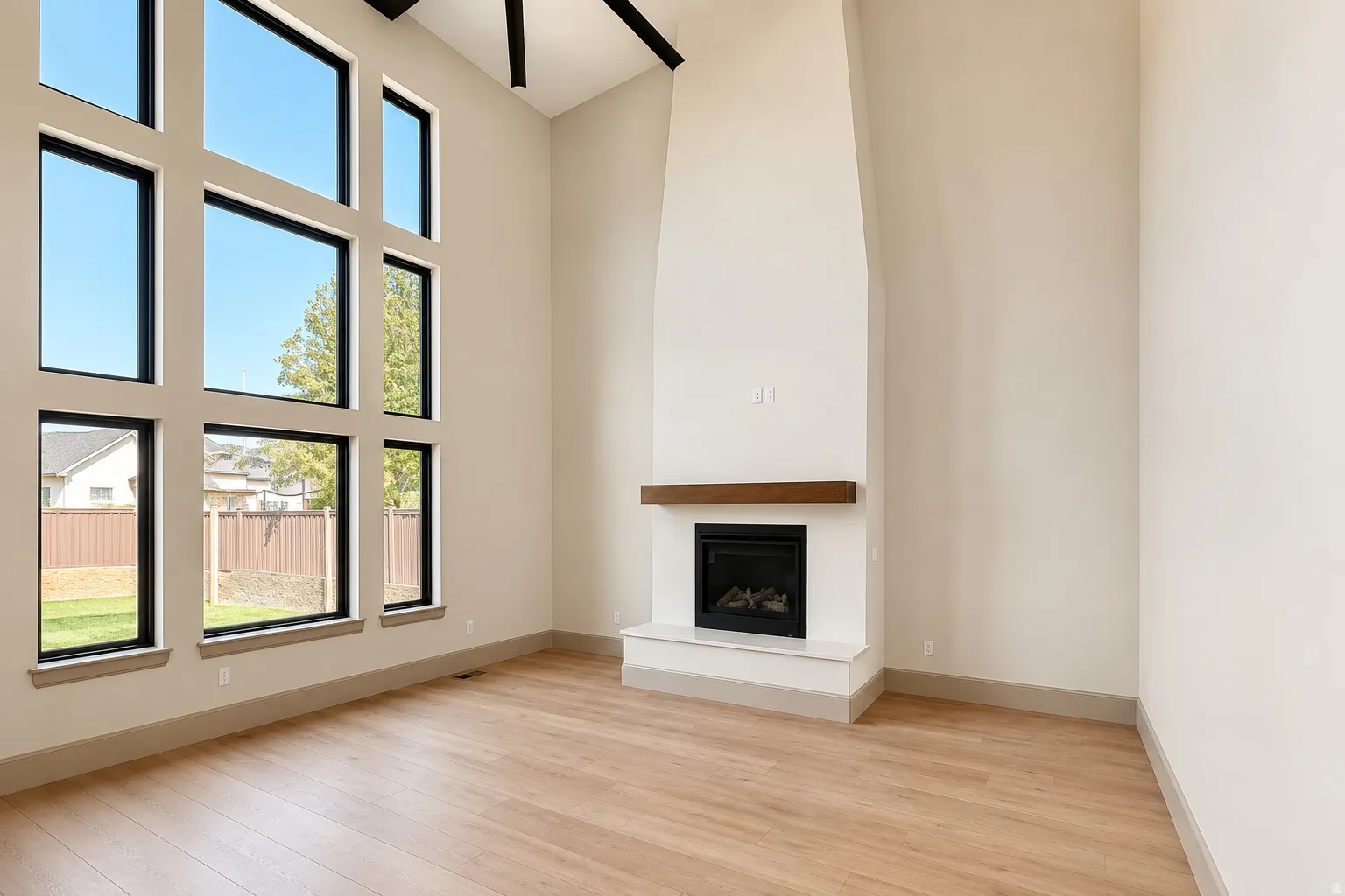 Two-story, vaulted ceilings and fireplace, and new windows.
