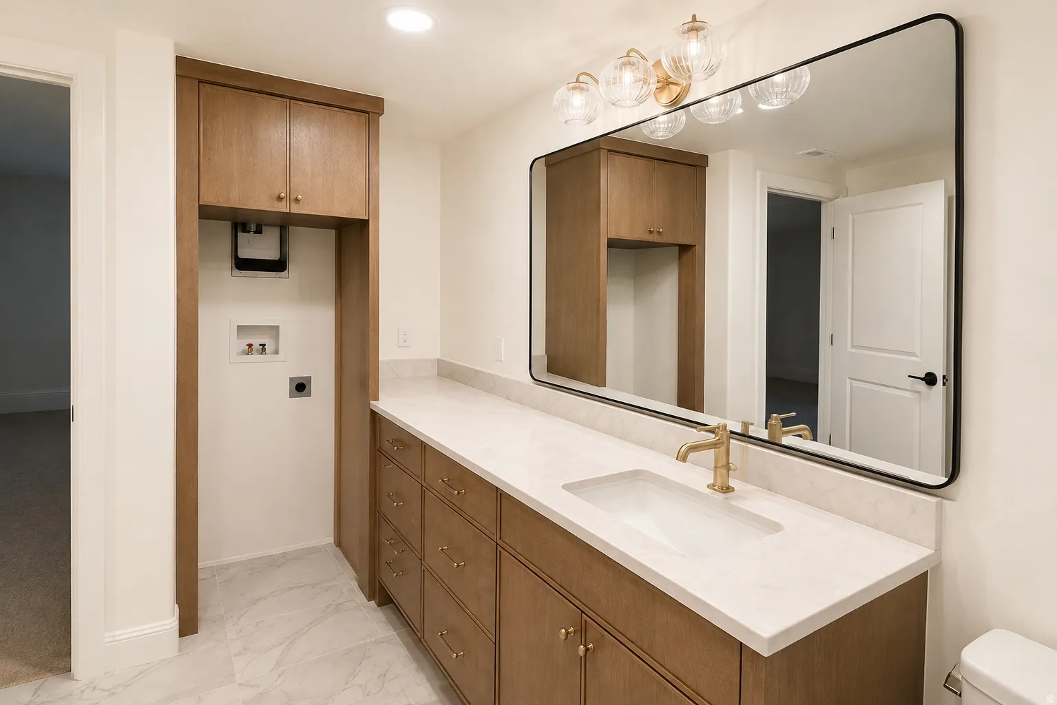 Integrated laundry area with upper cabinetry