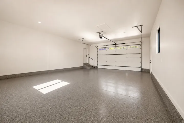 Newly added deep, two-car, spacious garage featuring brand new durable epoxy floors