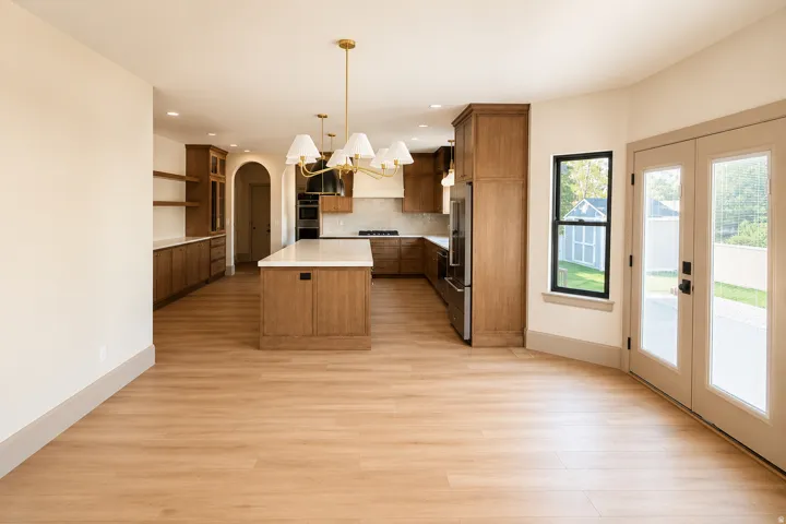 Open-concept kitchen and dining area featuring a walk out patio space.