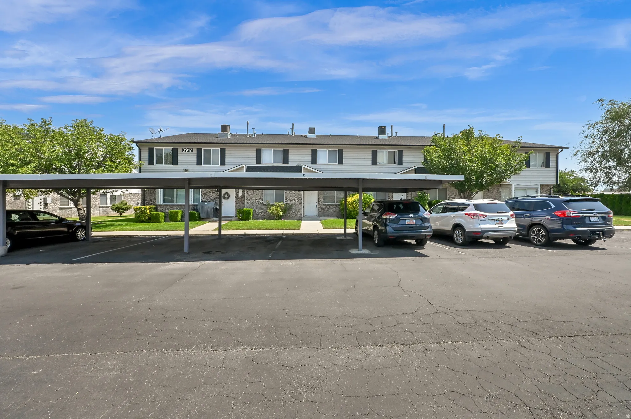 Carport parking space with asphalt paving