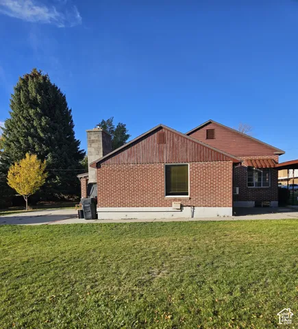 South side of home has a large lawn