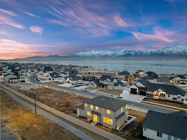 Modern residential community overlooking expansive water and mountain scenery