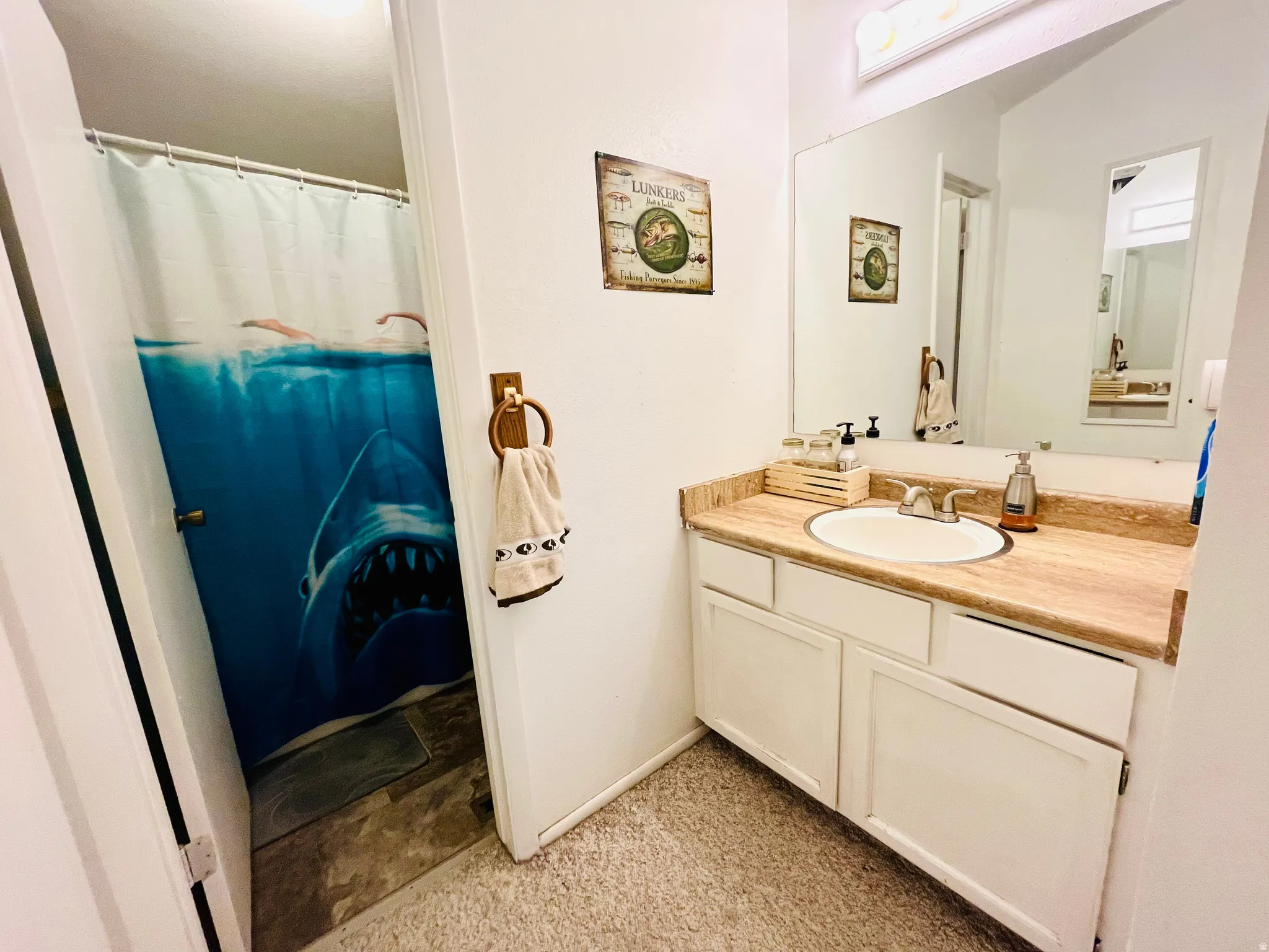 Full bathroom with a spacious vanity and clean, functional design.