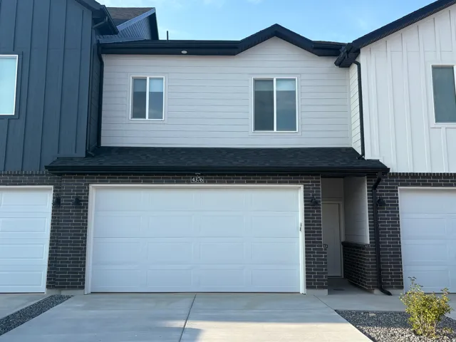 Grey brick facade with white mortar