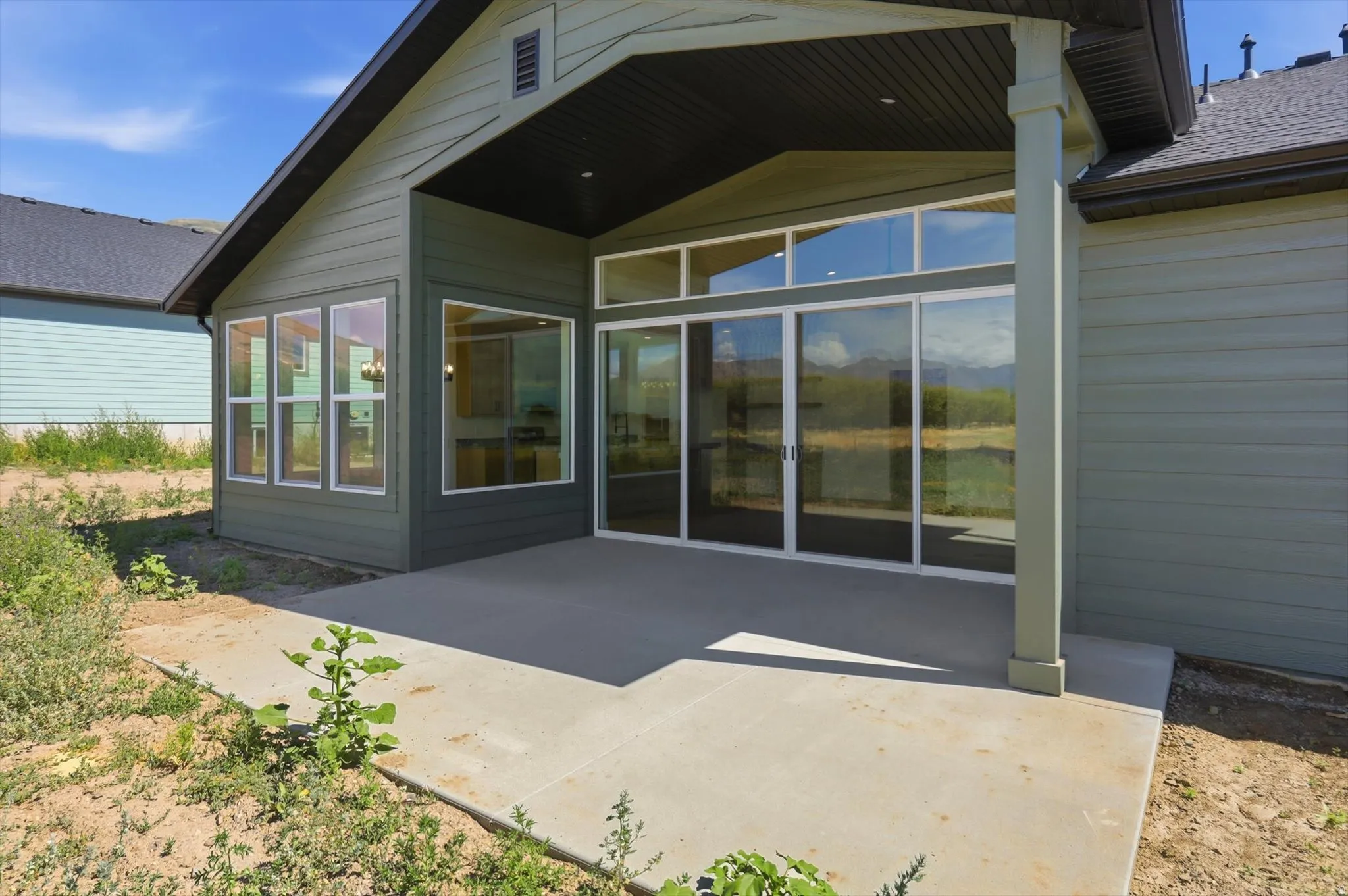 Covered patio space featuring a concrete slab and direct outdoor access