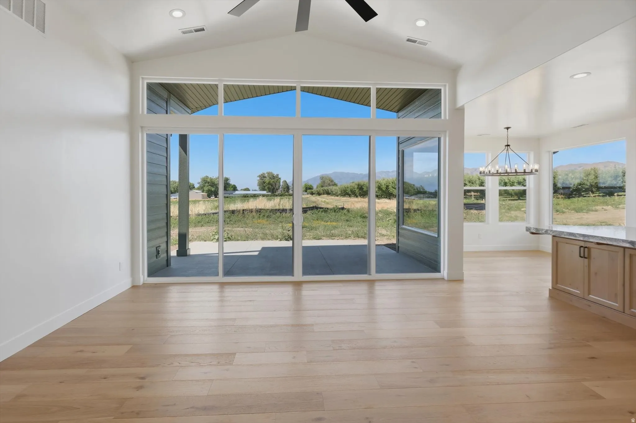 Wood-finish flooring, vaulted ceilings, and recessed lighting