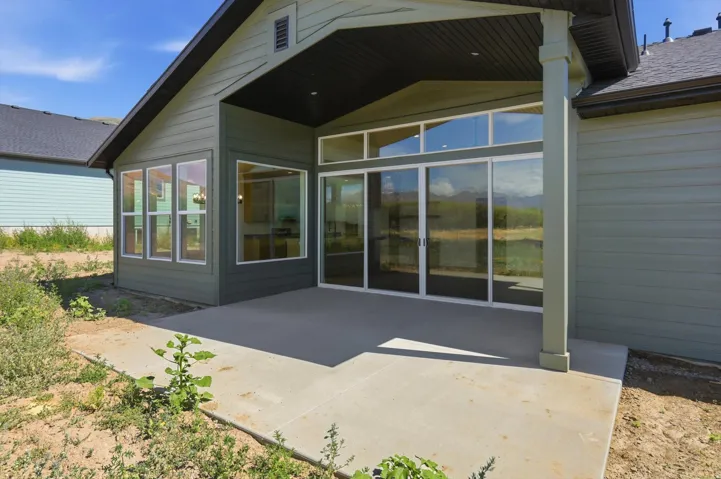Covered patio space featuring a concrete slab and direct outdoor access