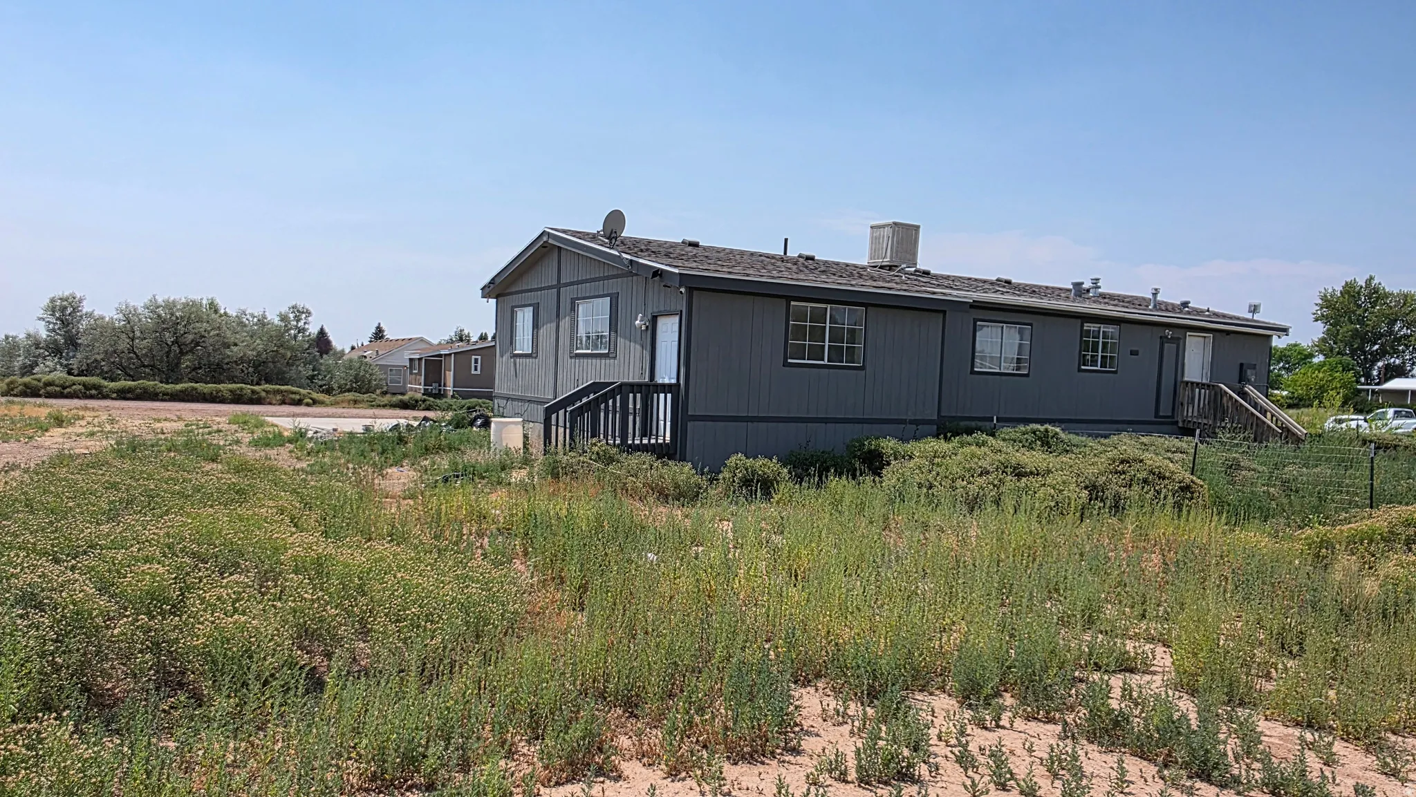 Gray exterior siding with white trim