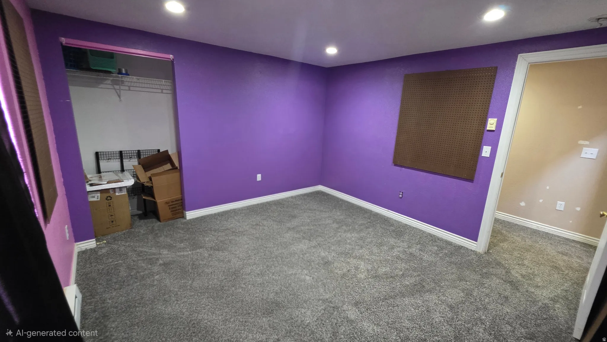 Recessed lighting illuminates the room with gray carpeting and a built-in closet featuring wire shelving