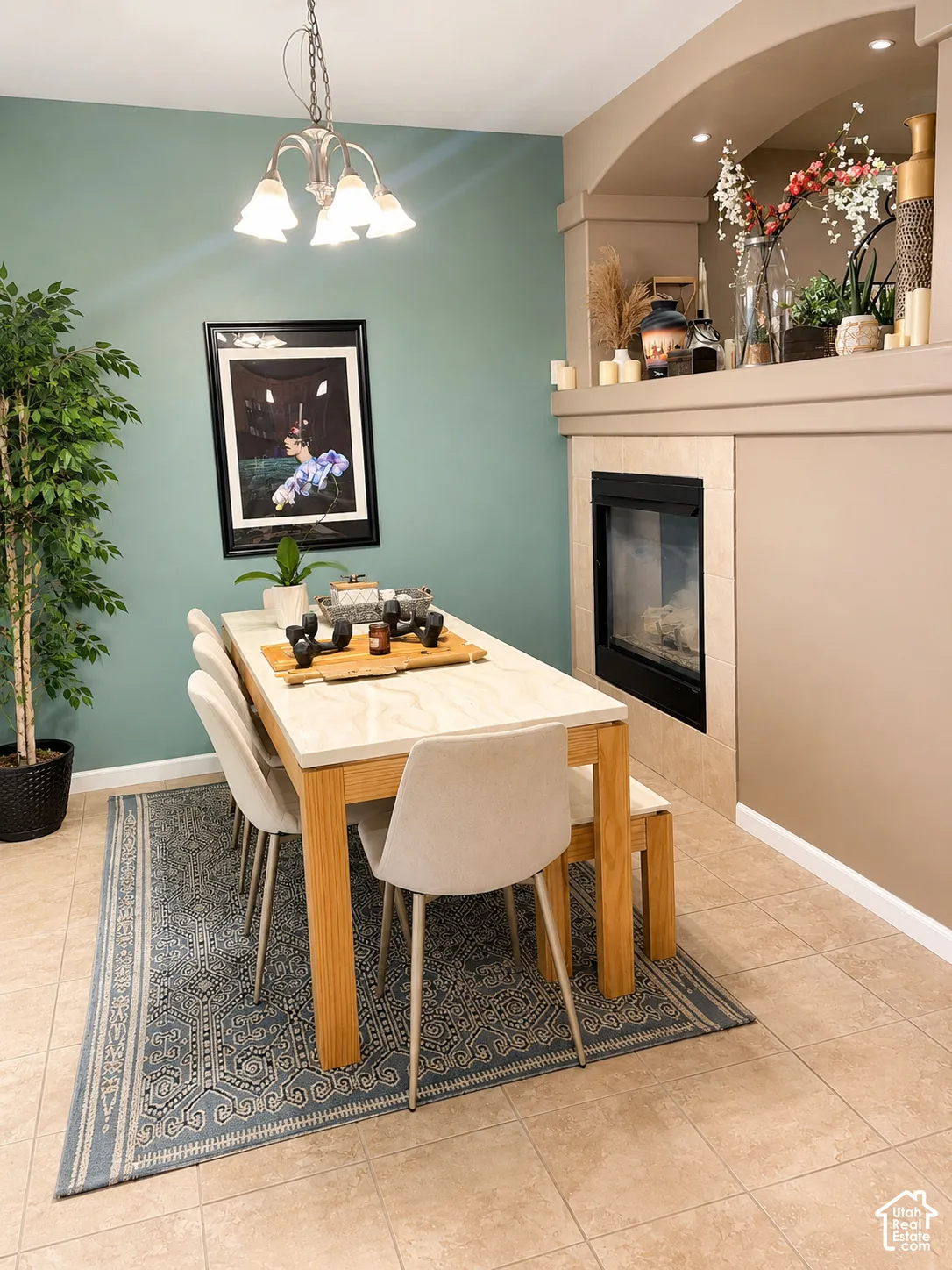 Built-in fireplace with a tiled surround, recessed shelving, and integrated lighting