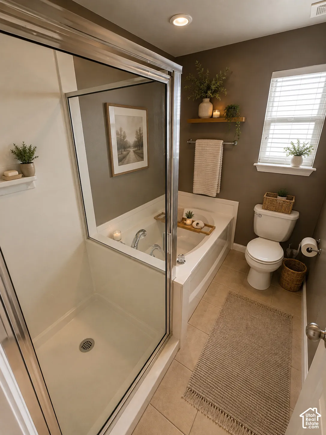 Enclosed shower with clear glass door, built-in bathtub, ceramic tile flooring, single window with blinds, and recessed lighting
