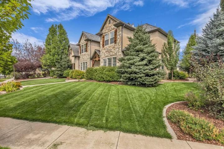 Stone and stucco exterior with multiple gables