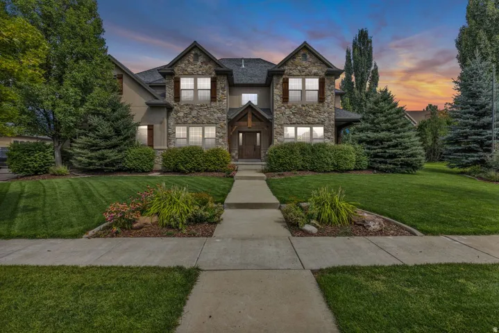Stone and stucco exterior with gabled roof lines