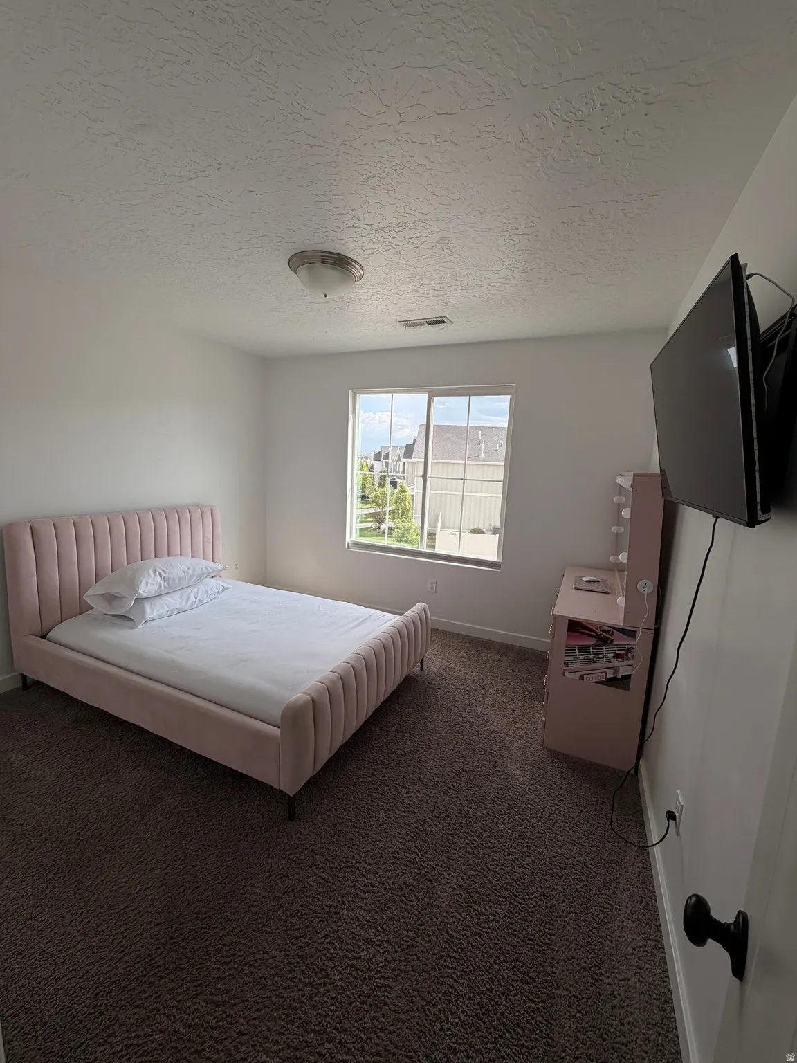 Textured ceiling with a flush-mount light fixture