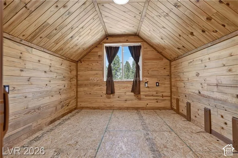 Wood plank walls and vaulted wood plank ceiling