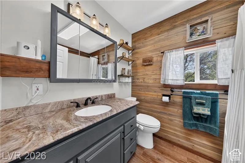Wood-finish flooring with a coordinating wood plank accent wall