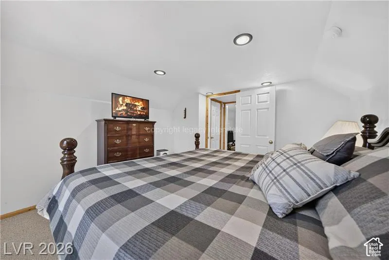 Recessed lighting fixtures, sloped ceiling, white paneled door
