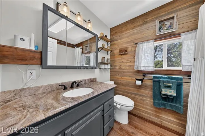 Wood-finish flooring with a coordinating wood plank accent wall