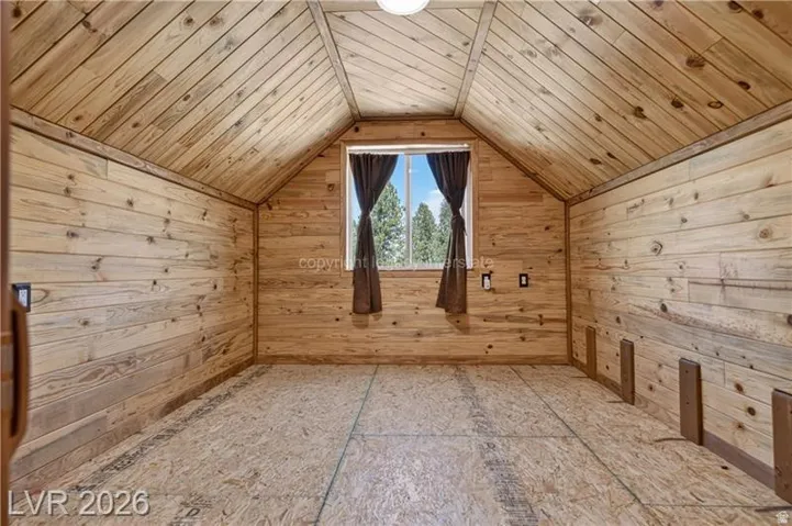 Wood plank walls and vaulted wood plank ceiling