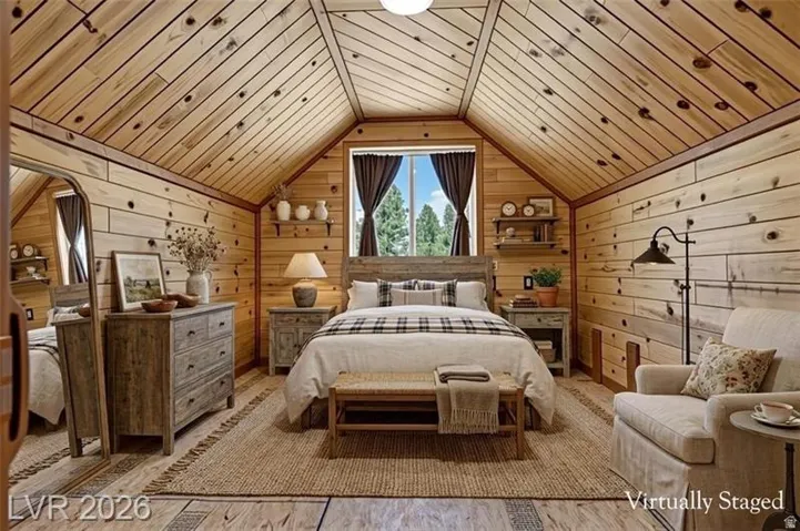 Wood-paneled walls and ceiling, pitched ceiling design, window with exterior views, integrated shelving