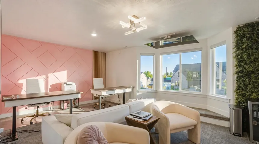 Expansive bay windows, ceiling-mounted light fixture, decorative wall paneling, vertical slat accent wall, and built-in vertical garden feature