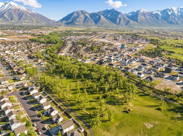 Expansive residential area featuring numerous homes, established streets, and abundant mature trees