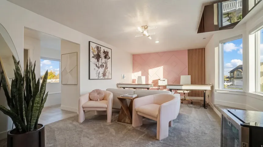 Expansive room featuring a plush carpet, large bay windows, and recessed lighting