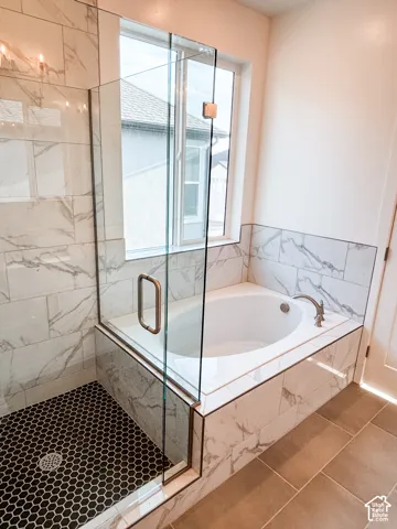 Primary Bathroom with walk in shower and soaker tub.