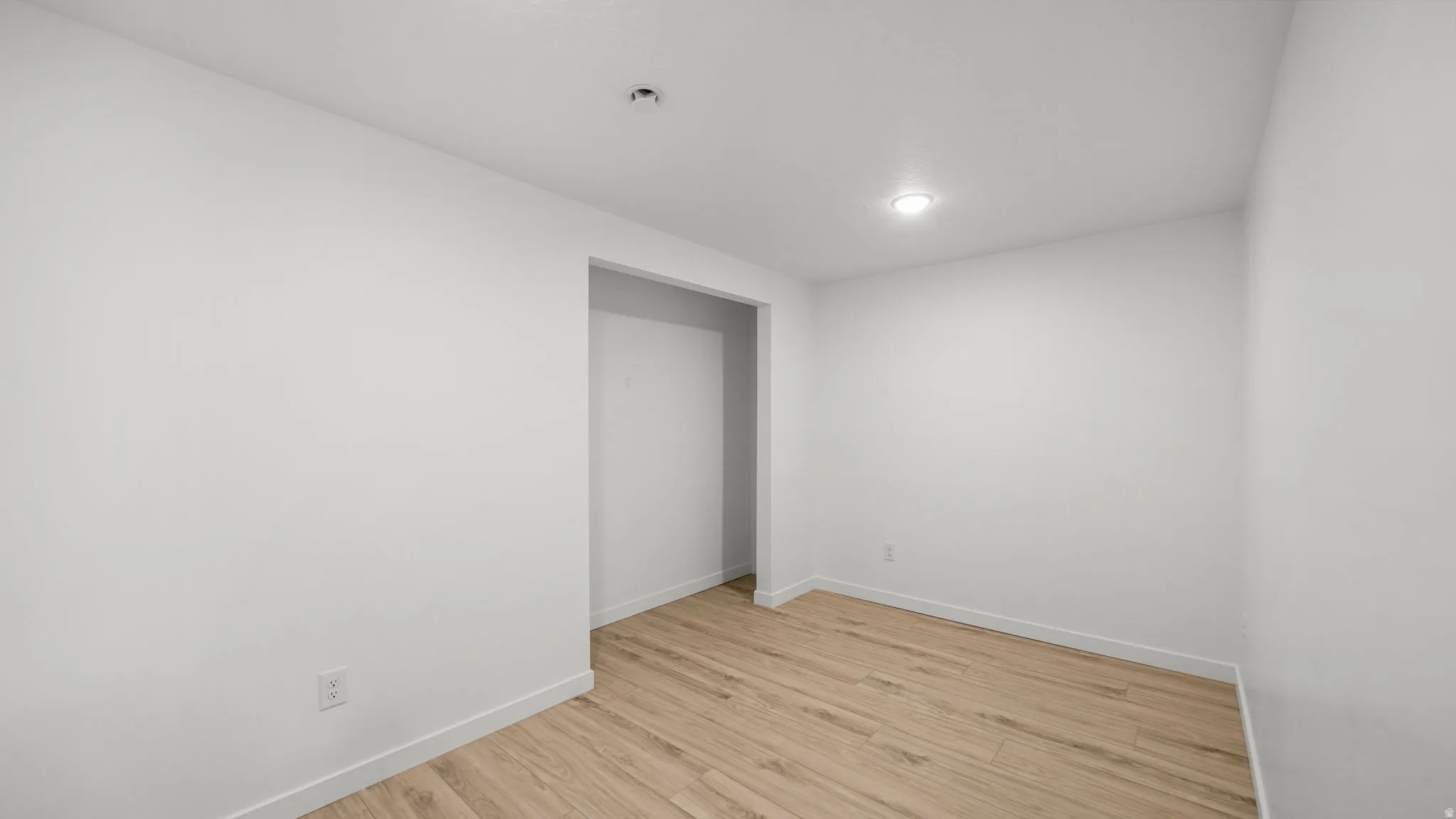 Bedroom/Office with recessed lighting, wood-finish flooring, and crisp white walls