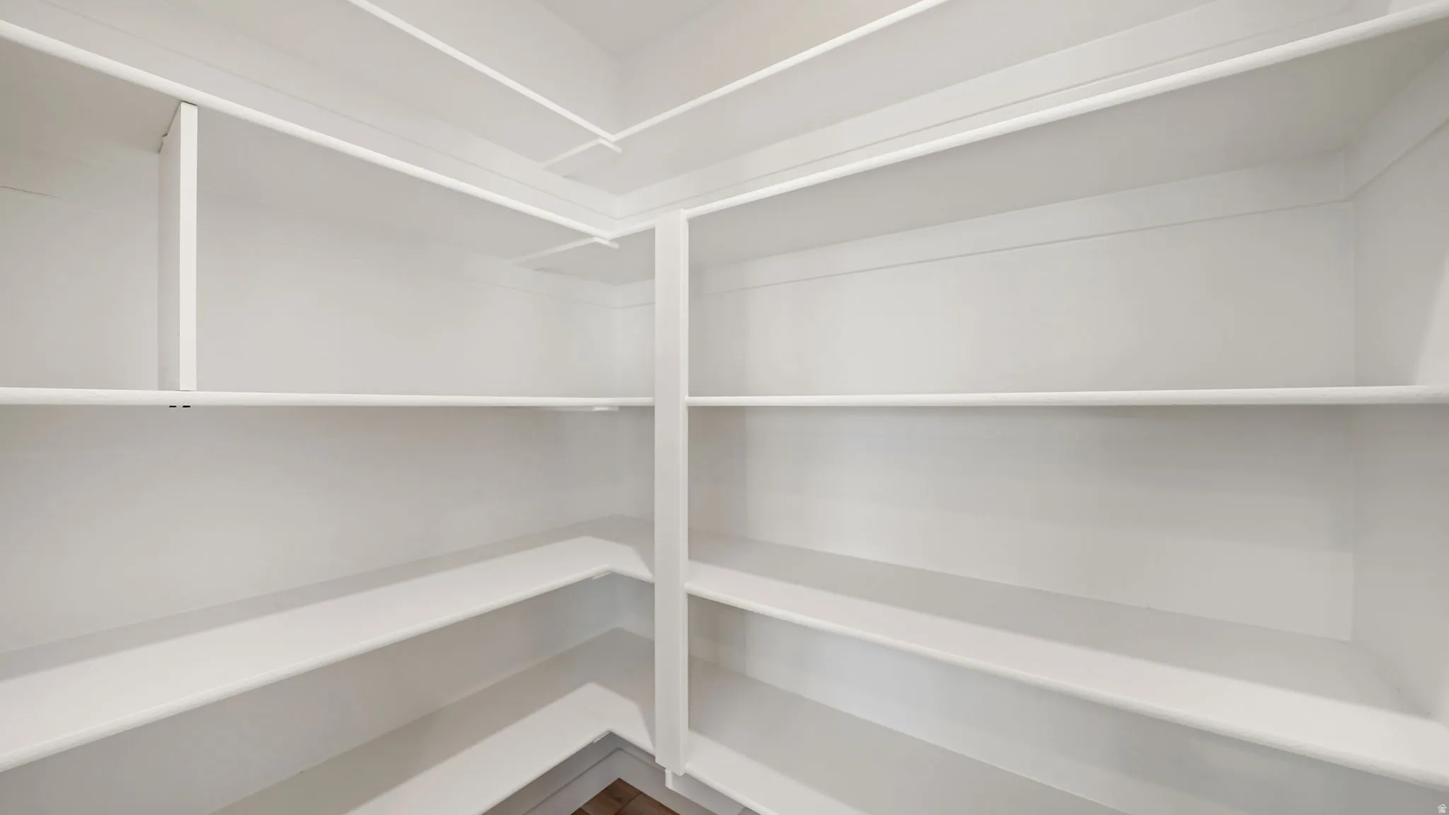 Built-in shelving with white finishes, offering multiple levels of storage