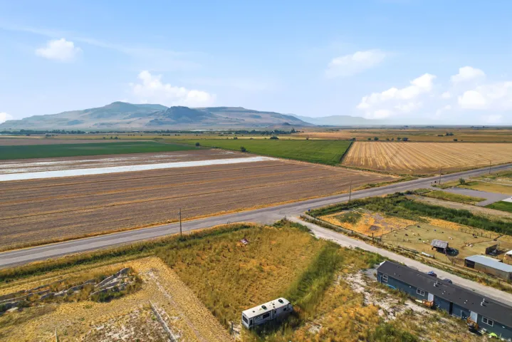 Expansive agricultural land and mountain backdrop