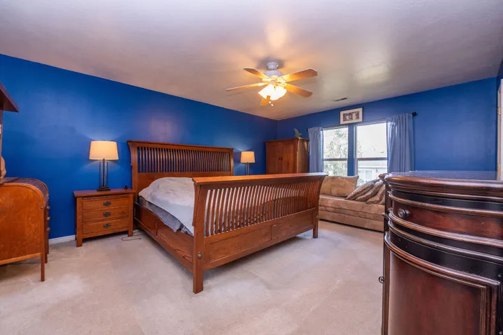 Spacious Primary Bedroom, with ensuite bathroom, spacious closet and natural lighting.