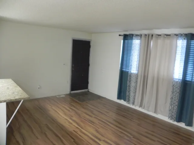 Wood-finish flooring with a light-toned wall finish